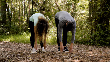 Couple-stretching-outdoors