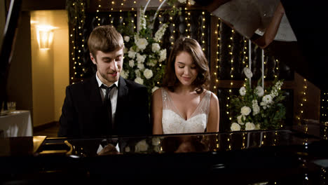 Couple-playing-piano