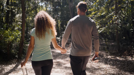 Couple-walking-on-the-woods