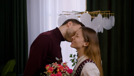 A-couple-smiling-at-the-camera