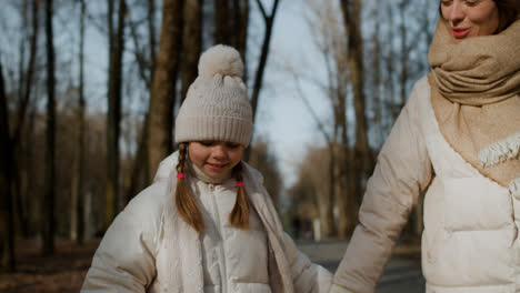 Little-girl-walking-with-mom