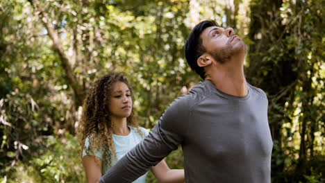 Couple-stretching-outdoors