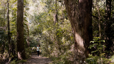 Young-woman-running-in-the-forest