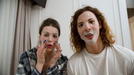 Couple-with-face-mask-recording-a-video