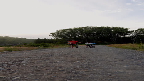 Dad-and-son-walking-with-bike