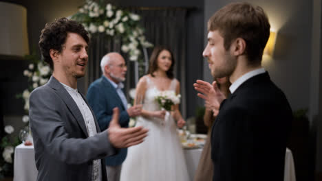 Groom-hugging-friend