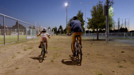 Dad-and-daughter-riding-bike