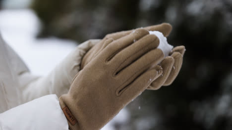 Person-playing-with-snow