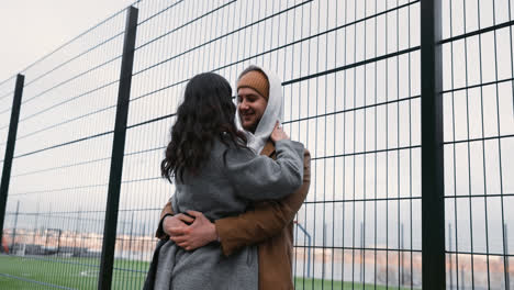 Couple-hugging-outside