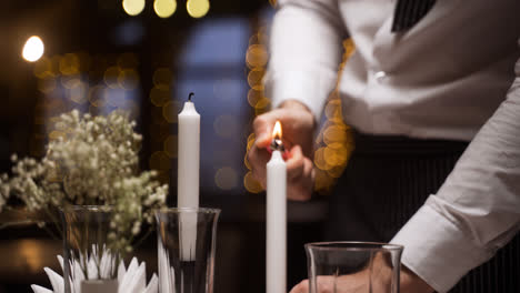 A-waiter-lighting-candles