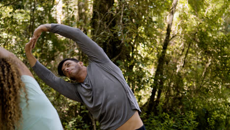 Couple-stretching-outdoors