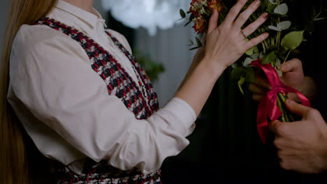 Man-giving-flowers-to-wife