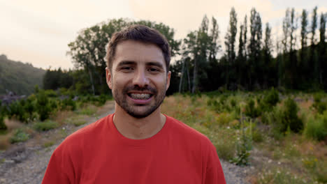 Man-smiling-at-camera