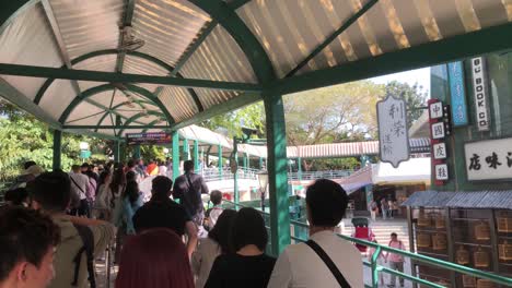 People-standing-in-line-to-use-the-summit-cable-car-in-Ocean-Park,-Hong-Kong