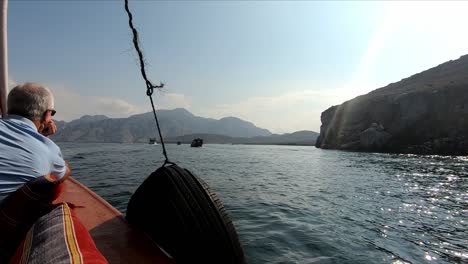 Mature-man-on-tour-boat-boating-on-khasab-sea