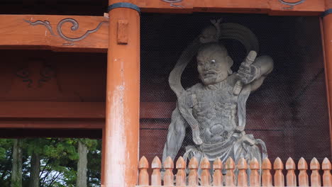 Koyasan-Daimon-Gate,-wooden-Kongo-Rikishi-statue,-intricate-craftsmanship,-cultural-Japanese-artwork
