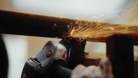 Cutting-old-metal-tube-with-angle-grinder