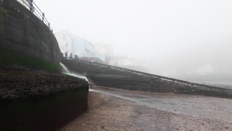 People-walking-along-the-quite-streets-of-Staithes-a-sleepy-fishing-village-on-the-Yorkshire-coast-of-England