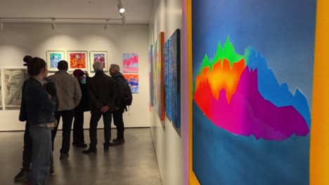 colorful-artwork-in-art-exhibition-gallery-in-Iran-people-visiting-modern-fine-art-in-Tehran-freedom-life-for-women-peaceful-space-to-enjoy-interesting-modern-fair-painting-drawing-creative-museum