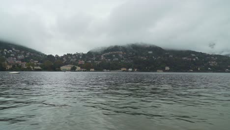 Beautiful-Colourful-Villas-of-Como-Lake-Village-Disappear-in-Cloudy-Morning