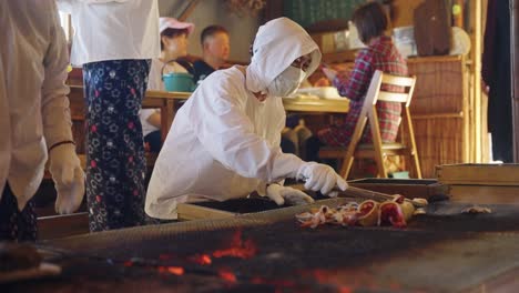 Slow-motion-low-angle-pan-over-barbecuing-seafood