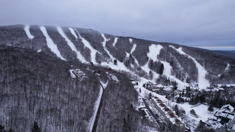 Ski-slopes-in-the-Appalachian-mountains-of-west-Massachusetts-with-a-winter-village-and-sports-complex-covered-in-blankets-of-white-snow