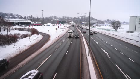 Cars-and-trucks-driving-on-the-E18-motorway-in-the-daytime