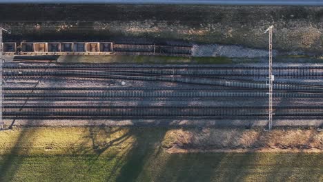 Dusk-Light-on-Zug-Railway,-Switzerland---aerial-overhead-view