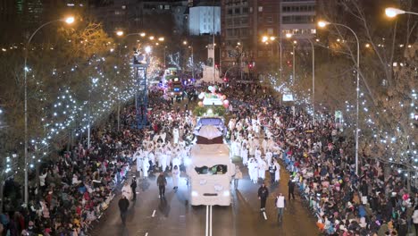 Float-riders-at-the-Three-Wise-Men-festival,-also-known-as-the-Three-Kings-Parade,-join-families-and-spectators