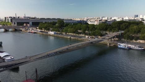 Passerelle-Simone-de-Beauvoir-or-Bercy-Tolbiac,-pedestrians-and-cyclists-bridge-on-Seine-River-in-Paris,-France