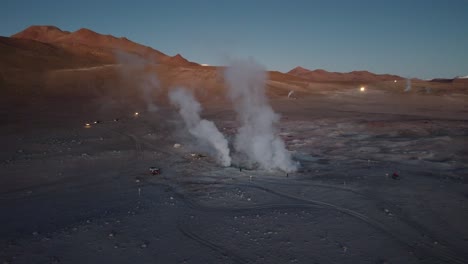 Dawn-aerial-to-steaming-geological-geysers-at-Sol-de-Manana-in-Bolivia