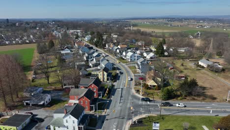 Traffic-on-junction-during-sunny-day-in-rural-american-town