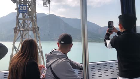 Tourists-video-the-view-from-the-Ngong-Ping-cable-car