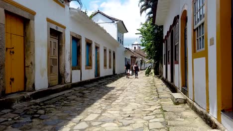 Strolling-through-Paraty's-cobblestone-streets,-a-journey-through-history-and-charm-unfolds-with-every-step