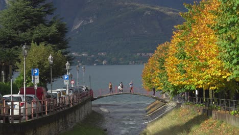 People-Takes-Photos-on-the-Cute-Stone-Bridge-in-Town-of-Varenna