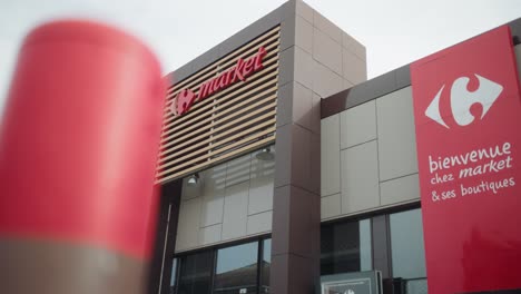 Low-angle-view-of-a-French-supermarket-during-daytime-in-France