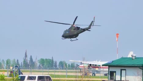 Military-helicopter-taking-off-from-airport-to-emergency-respond-in-Alberta,-Canada