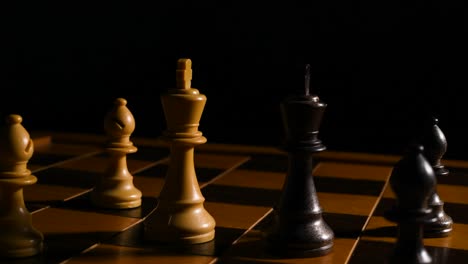 Cinematic-shot-of-two-king-chess-pieces-standing-across-from-each-other-with-2-pawns-behind-them