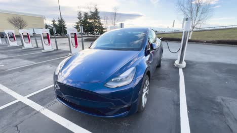 Tesla-Model-Y-charging-at-a-supercharger-facility