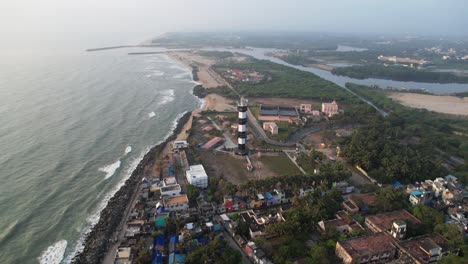 Aerial-video-of-a-light-house-designed-to-emit-light-from-a-system-of-lamps-and-lenses-and-to-serve-as-a-beacon-for-navigational-aid,-for-maritime-pilots-at-sea