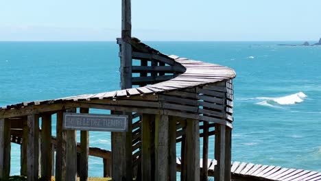 Muelle-del-tiempo-in-Cucao,-scenic-Spiral-shape-monument-in-Tepuhueico-Park,-Ocean-in-Background