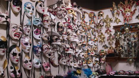 Kaleidoscope-of-Venetian-masks-at-Ca'-Macana,-Italy