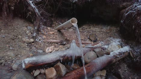 Fresh-water-well-spring-in-the-forest-in-winter-close-up-approached