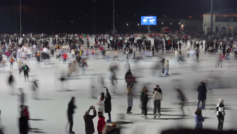 Establishing-view-of-people-enjoying-ice-skating-at-City-Park,-Budapest