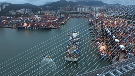 Hong-Kong-container-port-with-large-container-ship---moody-weather,-at-dusk