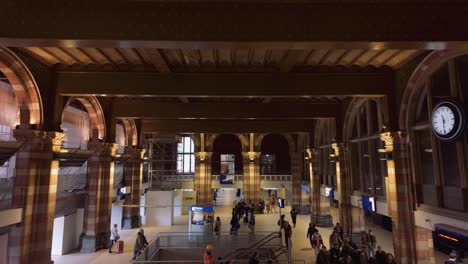 Dolly-to-right-of-Amsterdam-Central-hall-in-filmic-train-station-interior