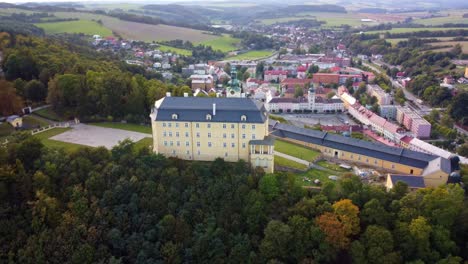 Fulnek-Castle,-Located-Atop-a-Hill-in-the-Czech-Republic---Aerial-Pullback