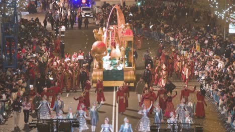 King-Gaspar-and-parade-float-greet-children-and-families-at-the-Three-Wise-Men-festival,-also-known-as-the-Three-Kings-Parade