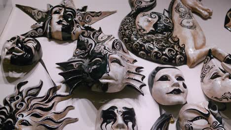 Black-and-white-swirl-Venetian-masks,-Ca'-Macana