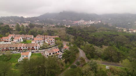 Aerial-dolly-shot-of-the-foggy-hills-in-Sintra-Portugal-in-winter